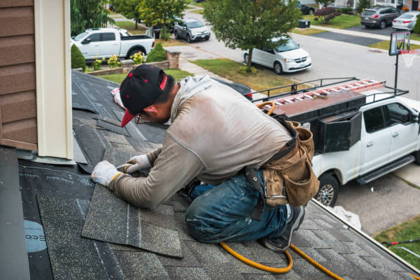 Professional Roofing technician working in Otley, IA